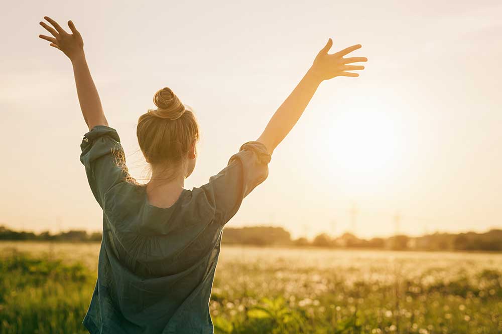 a girl feeling relieved from anxiety after completing treatment