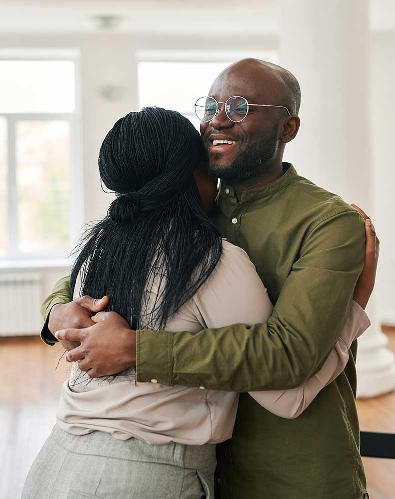 patient hugging his therapist after completing a psychiatric therapy session in Burlington